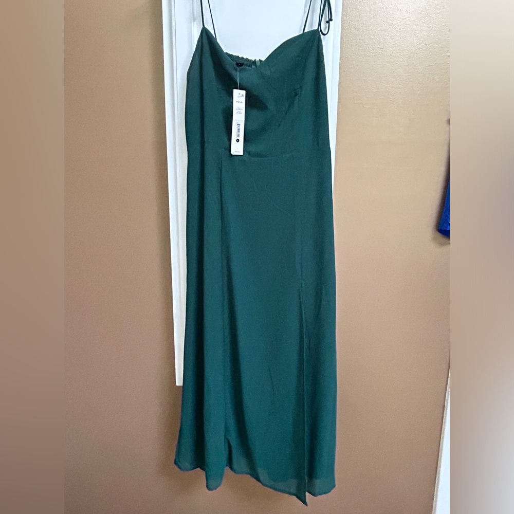 NEW- never worn, with tag on. MIDI dress with high slit